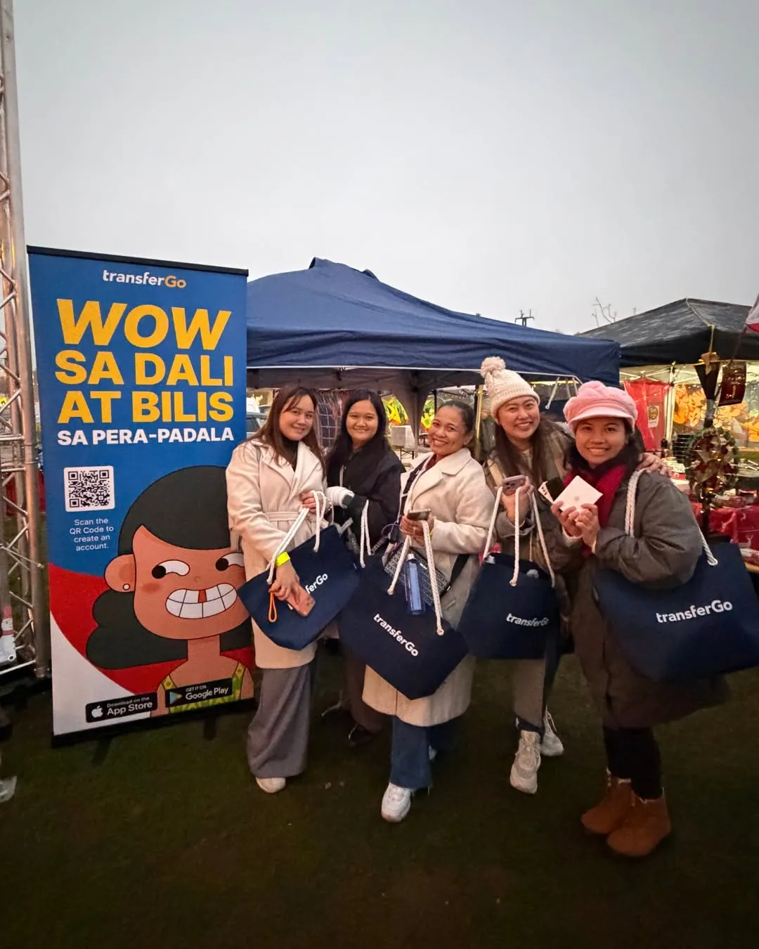 TransferGo festival booth with community attendees in Europe