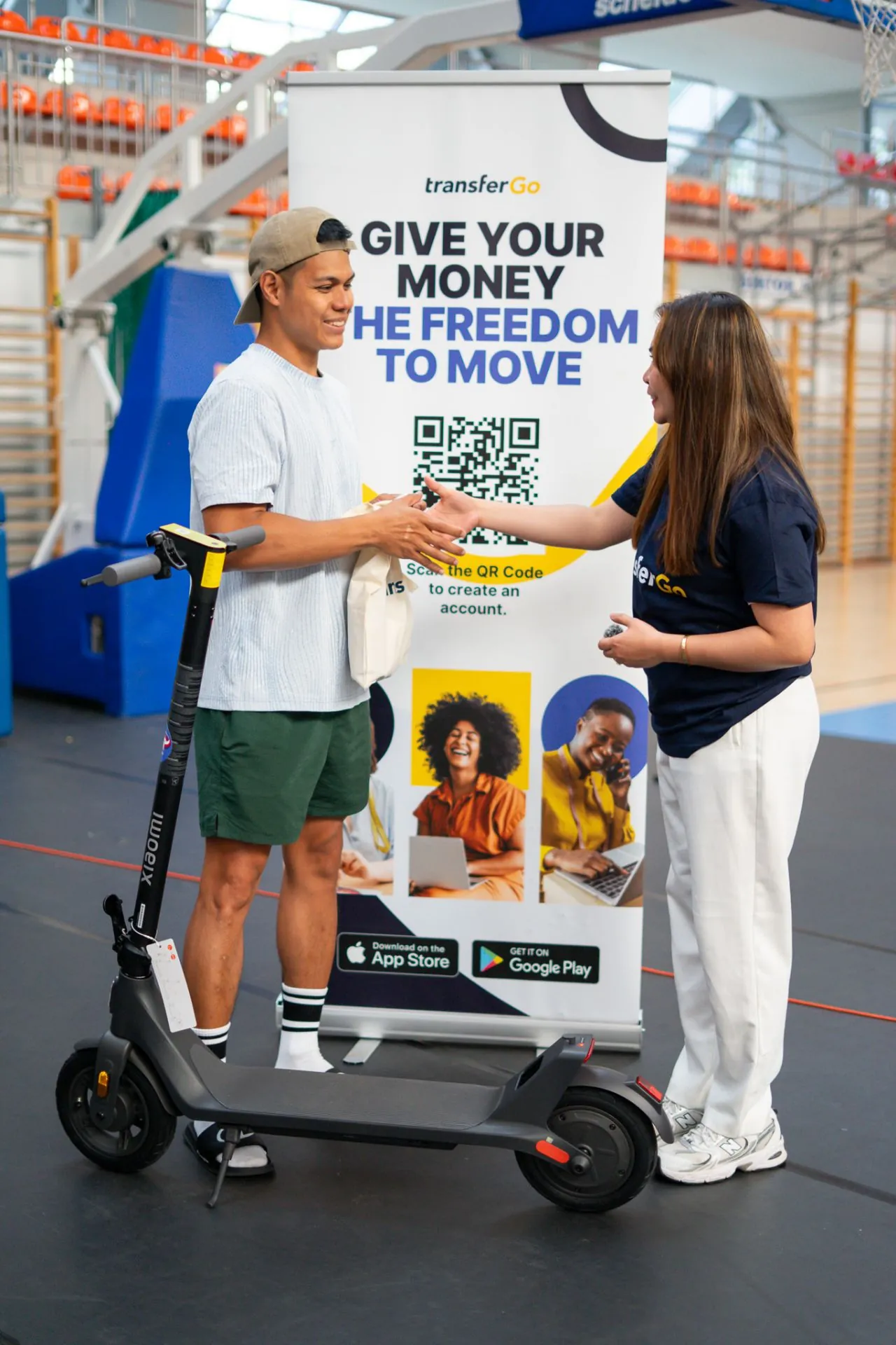 Winner receiving the TransferGo e-scooter giveaway prize