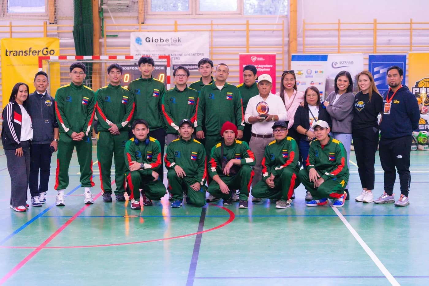 Team photo with the Philippine flag at the Filipino sports tournament in Poland
