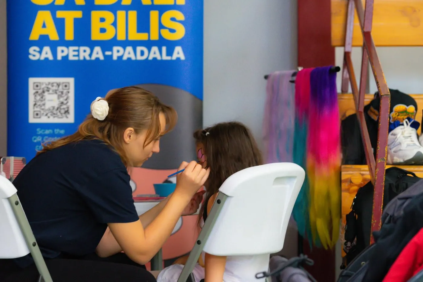 Face painting at the TransferGo family activation booth